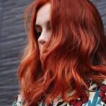 Kevin Murphy Red Hair Color Model Model with vibrant red hair colored using Kevin Murphy hair color at Blondology Salon
